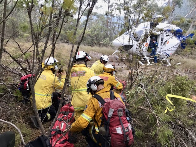 NSW Rural Fire Service (RFS) Remote Area Firefighting Team members about to board a helicopter at Linden Ridge, in the Blue Mountains National Park