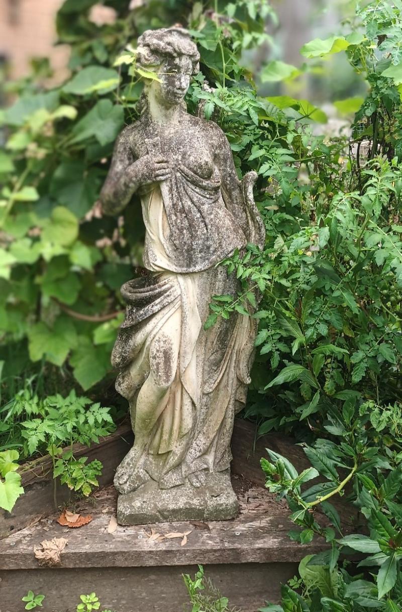 A statue of the Greek Goddess Artemis gazes over the Urban Farmer garden in Springwood